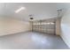 Spacious garage with epoxy flooring and an automatic door opener at 2308 Holly Pine Cir, Orlando, FL 32820