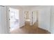 Hallway with neutral carpet, showcasing access to a bathroom and bedroom at 2308 Holly Pine Cir, Orlando, FL 32820