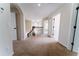 Upstairs hallway with neutral carpet, white trim, and natural light at 2308 Holly Pine Cir, Orlando, FL 32820