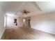 Spacious main bedroom featuring a tray ceiling, ceiling fan, and neutral carpeting at 2308 Holly Pine Cir, Orlando, FL 32820