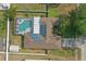 An aerial view showing the roof, solar panels, backyard pool, and shed at 2423 Auld Scot Blvd, Ocoee, FL 34761