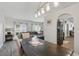 Open-concept dining room leading to a comfortable living room and modern kitchen at 2423 Auld Scot Blvd, Ocoee, FL 34761
