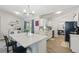 Bright, modern kitchen with a large island, white cabinets, and stainless steel appliances at 2423 Auld Scot Blvd, Ocoee, FL 34761
