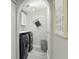 Laundry room with modern washer and dryer, overhead lighting, and tiled floors at 2423 Auld Scot Blvd, Ocoee, FL 34761