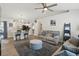 Open living space with kitchen island, casual seating, and comfortable sofa with decor at 2423 Auld Scot Blvd, Ocoee, FL 34761