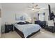 Tranquil main bedroom with ceiling fan, stylish décor, and dark wood furniture at 2423 Auld Scot Blvd, Ocoee, FL 34761