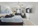 Vaulted ceiling main bedroom with blue accents, ceiling fan, and modern decor at 2423 Auld Scot Blvd, Ocoee, FL 34761