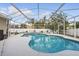 A clear and inviting pool with a screened enclosure provides a refreshing backyard oasis at 2423 Auld Scot Blvd, Ocoee, FL 34761