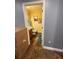 Powder room featuring a patterned wall, cabinet sink, and a toilet at 2737 Merrieweather Ln, Kissimmee, FL 34743