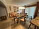 Bright dining area featuring modern lighting fixture and a large glass sliding door at 2737 Merrieweather Ln, Kissimmee, FL 34743