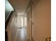 Bright entryway featuring tile flooring and staircase leading to upper level at 2737 Merrieweather Ln, Kissimmee, FL 34743