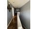 A long, well-lit hallway featuring beautiful tile flooring and neutral wall color at 2737 Merrieweather Ln, Kissimmee, FL 34743