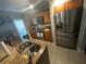 Bright kitchen featuring modern appliances, granite counters, and ample cabinet space at 2737 Merrieweather Ln, Kissimmee, FL 34743