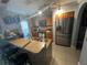 Well-equipped kitchen with stainless steel appliances and granite countertops at 2737 Merrieweather Ln, Kissimmee, FL 34743