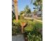 Scenic neighborhood street with lush greenery and mature trees at 2737 Merrieweather Ln, Kissimmee, FL 34743