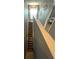 A carpeted staircase leads upstairs, bathed in natural light from a nearby window at 2737 Merrieweather Ln, Kissimmee, FL 34743