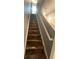 Staircase with carpet and white railing leading to the upper floor at 2737 Merrieweather Ln, Kissimmee, FL 34743