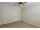 Cozy bedroom features neutral carpet, ceiling fan, and closet storage for a relaxing retreat at 2834 Bella Vista Dr, Haines City, FL 33844