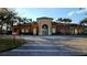 Community clubhouse with palm trees and ample parking at 2834 Bella Vista Dr, Haines City, FL 33844