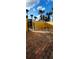 A beautiful brick-paved courtyard is surrounded by a stucco wall and a secure wrought iron gate at 2834 Bella Vista Dr, Haines City, FL 33844