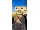 Beautiful walkway leading to the gated courtyard and entrance of this attractive two-story townhome at 2834 Bella Vista Dr, Haines City, FL 33844