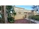 Inviting two-story townhome with private courtyard, secure gate, and lush tropical landscaping at 2834 Bella Vista Dr, Haines City, FL 33844