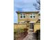 Charming two-story home with a gated courtyard, warm color scheme, and neatly landscaped greenery at 2834 Bella Vista Dr, Haines City, FL 33844