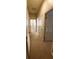 Long hallway with neutral carpet, and multiple doors at 2834 Bella Vista Dr, Haines City, FL 33844