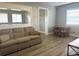 Cozy living room showcasing a neutral color palette, updated flooring, and a dining area at 2975 Avenue G Nw, Winter Haven, FL 33880