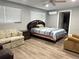 Spacious main bedroom with a ceiling fan, ample natural light, and wood-look flooring at 2975 Avenue G Nw, Winter Haven, FL 33880