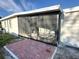 View of the screened porch area with red brick pavers at 2975 Avenue G Nw, Winter Haven, FL 33880