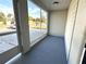 Outdoor screened-in porch area with view of the neighborhood at 2975 Avenue G Nw, Winter Haven, FL 33880