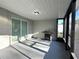 Outdoor screened-in patio with grill and sliding glass door at 2975 Avenue G Nw, Winter Haven, FL 33880