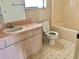 Bathroom featuring a single sink vanity, a toilet, and a shower/tub combo at 307 Santa Clara Cir, Lady Lake, FL 32159