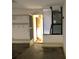 Interior view of a garage featuring a doorway to an adjacent room at 307 Santa Clara Cir, Lady Lake, FL 32159