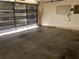 Garage interior with insulated door slightly open allowing natural light in at 307 Santa Clara Cir, Lady Lake, FL 32159