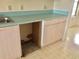 Kitchen with cabinets, drawers and aqua countertops at 307 Santa Clara Cir, Lady Lake, FL 32159