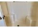 Enclosed shower stall with dual corner seats, providing convenience and comfort at 307 Santa Clara Cir, Lady Lake, FL 32159
