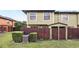 Backyard featuring privacy fence, shed, mature landscaping, and home's exterior at 3251 Oak Lake Pl # 135, Winter Park, FL 32792