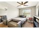 Cozy bedroom with a single bed, window, and storage bench at 3251 Oak Lake Pl # 135, Winter Park, FL 32792