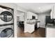 A well-lit kitchen featuring white cabinets, granite countertops, and stainless steel appliances at 3251 Oak Lake Pl # 135, Winter Park, FL 32792