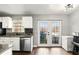 Functional kitchen with white cabinets and stainless steel dishwasher at 3251 Oak Lake Pl # 135, Winter Park, FL 32792