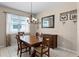 Cozy dining room with a wooden table set and decorative chandelier at 3416 Gerber Daisy Ln, Oviedo, FL 32766