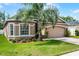 Beautiful single-Gathering home with a two-car garage, manicured lawn, and inviting curb appeal at 3416 Gerber Daisy Ln, Oviedo, FL 32766