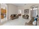 Open-concept living area featuring neutral tones and bright tile floors at 3416 Gerber Daisy Ln, Oviedo, FL 32766
