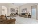 Spacious living area with a seating arrangement and decorative wall art at 3416 Gerber Daisy Ln, Oviedo, FL 32766
