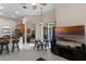 View of the open living area with bar seating and access to the outdoor patio at 3416 Gerber Daisy Ln, Oviedo, FL 32766
