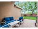 Cozy patio with blue cushioned seating, perfect for relaxing and entertaining outdoors at 3416 Gerber Daisy Ln, Oviedo, FL 32766