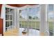 Bright breakfast nook with large windows offering serene views of the manicured lawn at 3617 Cherry Hill Dr, Orlando, FL 32822