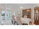 Formal dining room featuring elegant chandelier lighting, china cabinet and easy access to lanai at 3617 Cherry Hill Dr, Orlando, FL 32822